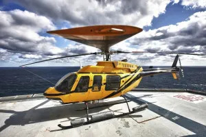 A Bell 407 utility helicopter on the helipad of an oil rig Poster Print (33 x 22)